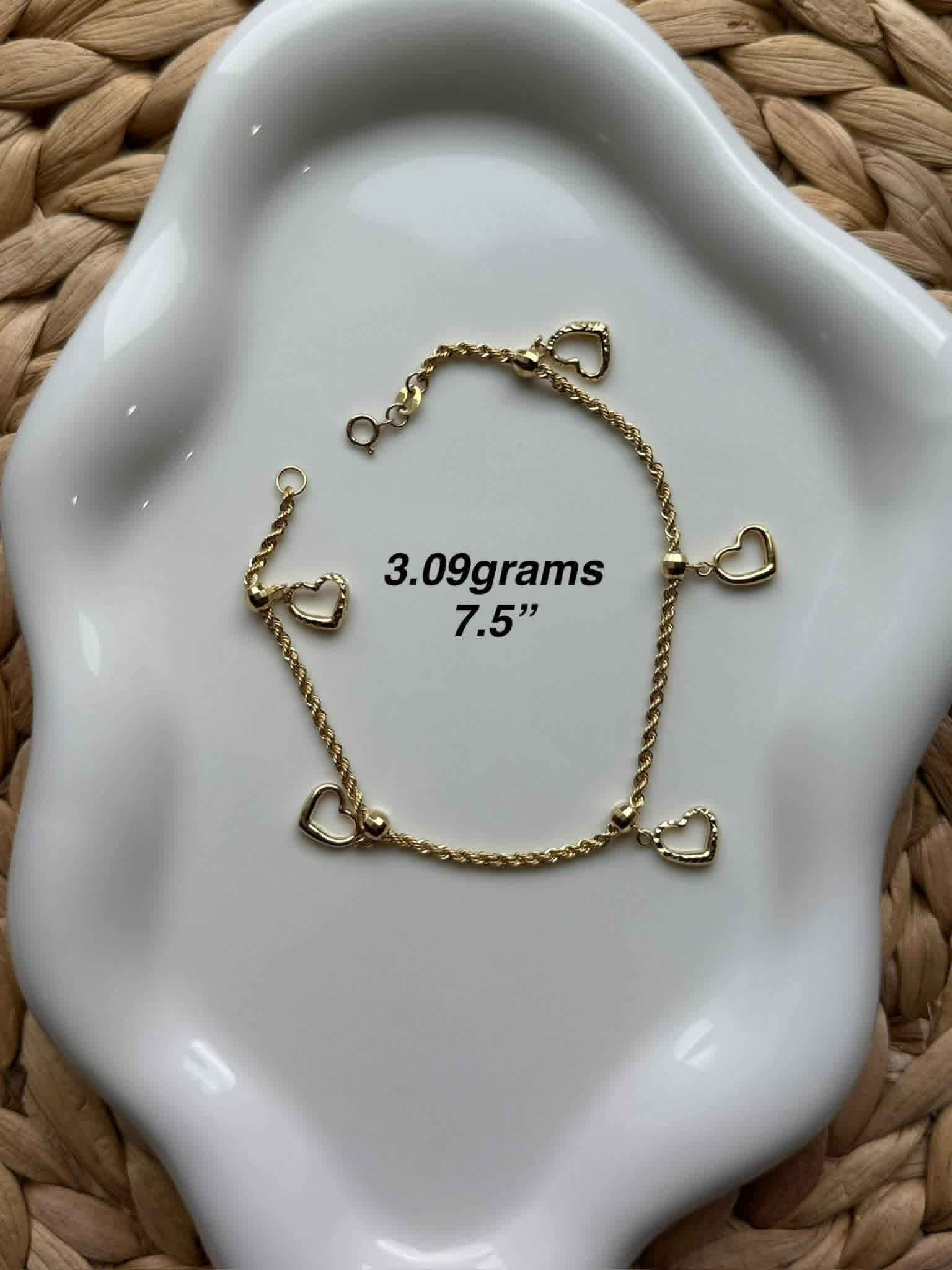 Gold rope chain bracelet with heart charms