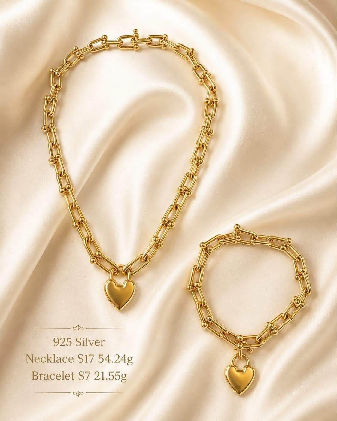 Gold-tone chunky link necklace and bracelet with heart padlock charms